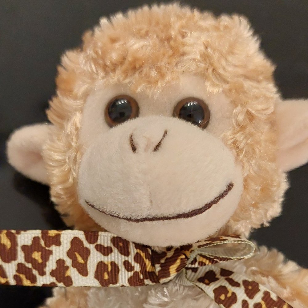 Brand-Animal Venture monkey stuffed animal. Beige 9' L 6' W